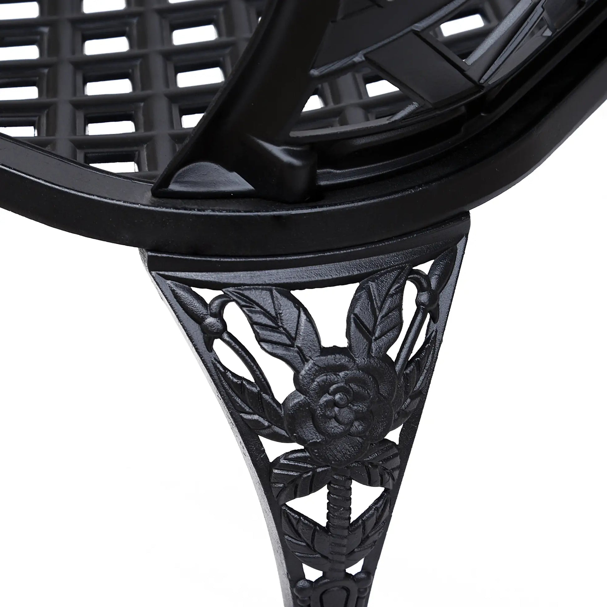 Close-up of a black metal decorative shelf bracket with intricate designs on a white background