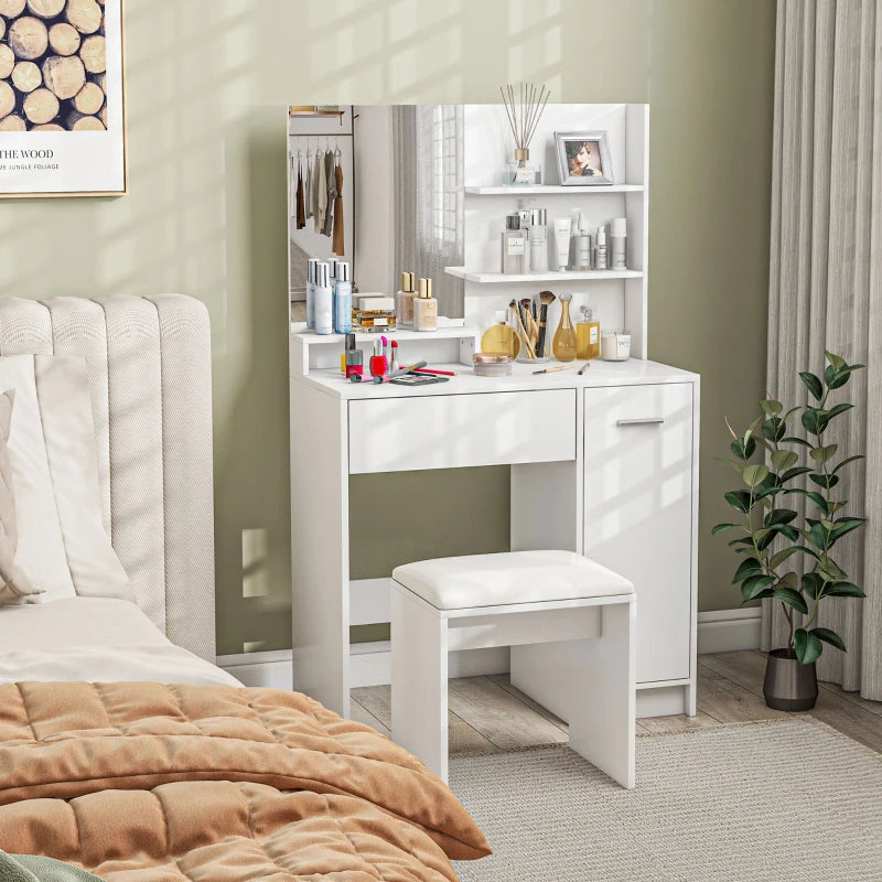 White vanity table with mirror and stool in a bedroom setting.