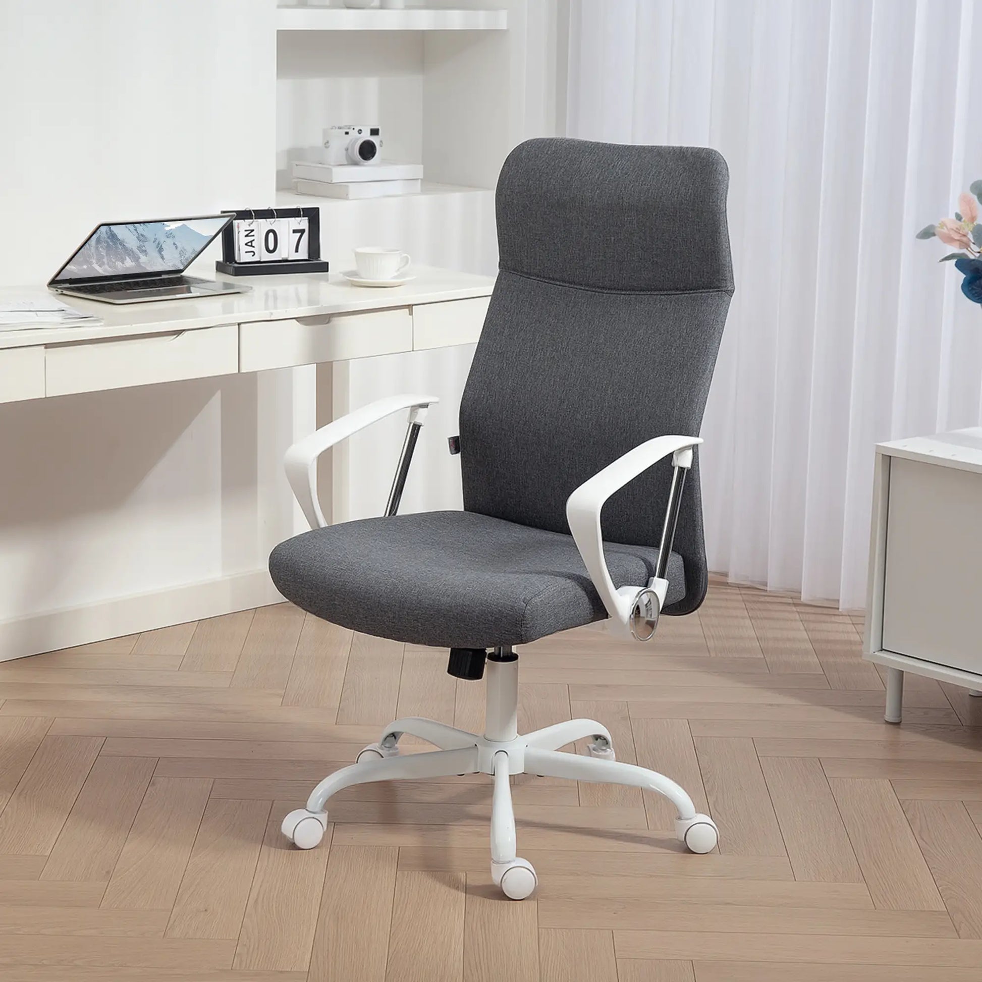 Gray office chair with white base in a home office setting
