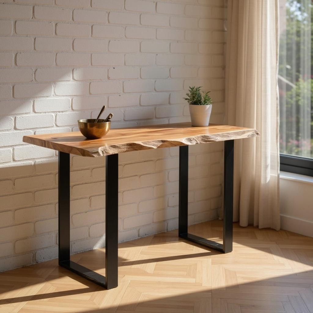 Wooden table with black metal legs in a room with a brick wall and window.