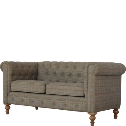 Gray checkered sofa with wooden legs on a white background