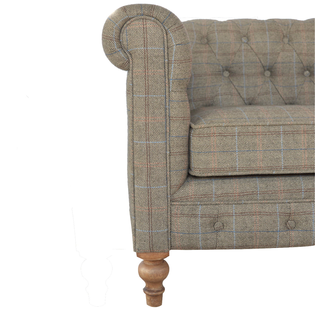 Corner of a tweed-patterned sofa with wooden legs on a white background