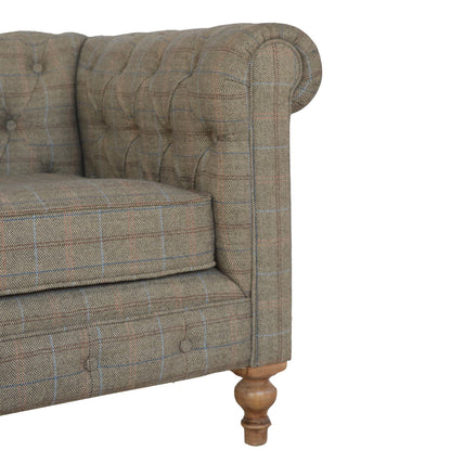 Brown checkered sofa with wooden legs on a white background
