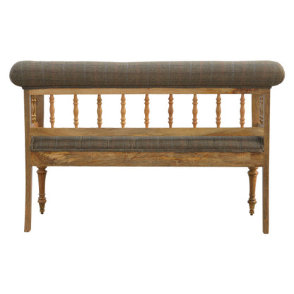 Wooden bench with upholstered backrest and seat on a white background