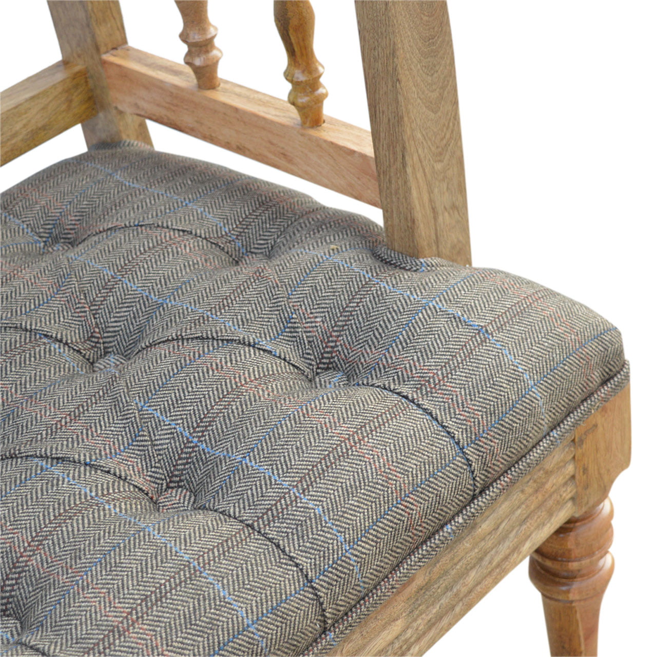 Wooden chair with a patterned cushion on a white background