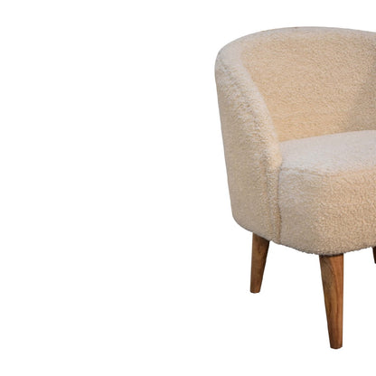 Beige armchair with wooden legs on a white background