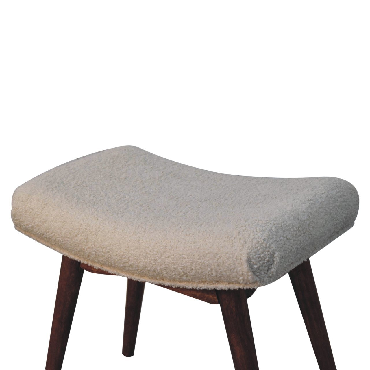 Stool with a textured beige cushion and wooden legs on a white background