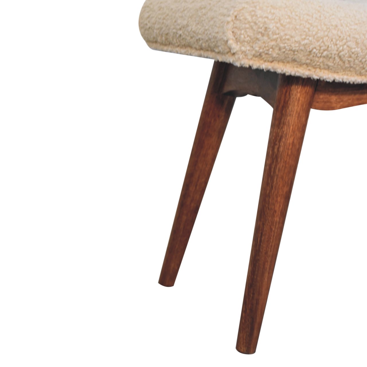 Close-up of a chair with wooden legs and beige cushioned seat on a white background
