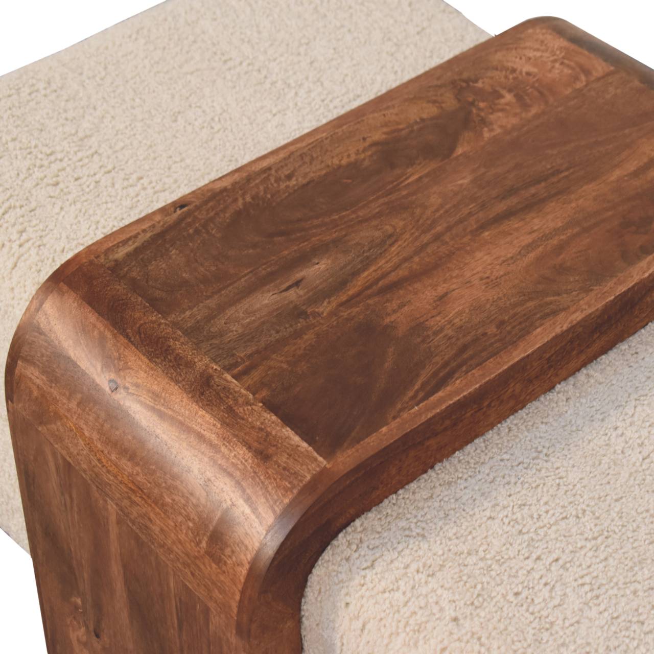 Wooden step stool on a carpeted floor