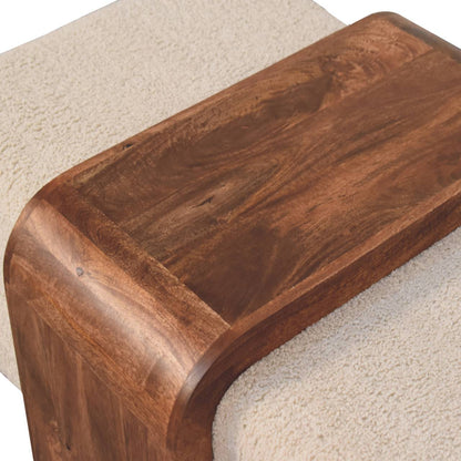 Wooden step stool on a carpeted floor