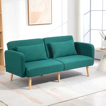 Teal sofa in a room with a window and decor