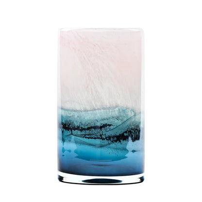 Tall cylindrical glass with gradient from white to blue on a white background
