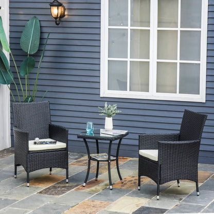 Outdoor patio set with two chairs and a small table on a stone patio against a blue house.