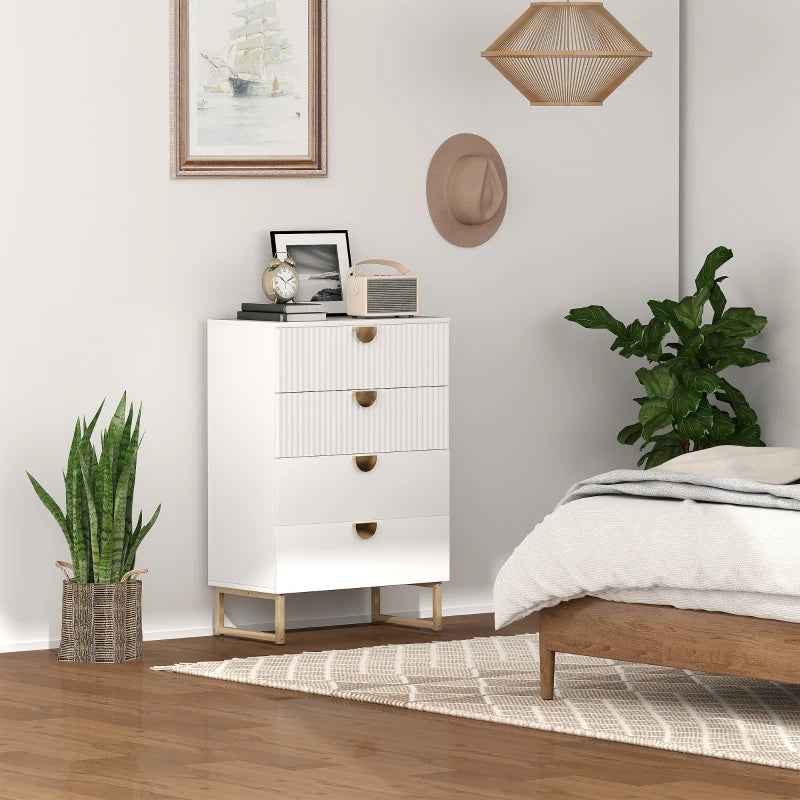 White dresser with gold accents in a bedroom setting with plants and decor.