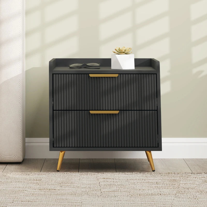 Black two-drawer nightstand with gold legs and handles in a room setting.