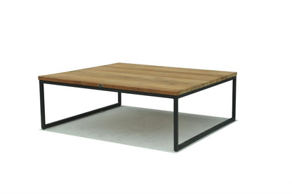Wooden coffee table with metal legs on a white background