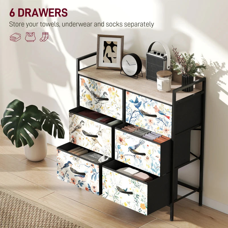 Black dresser with floral-patterned drawers in a room setting.