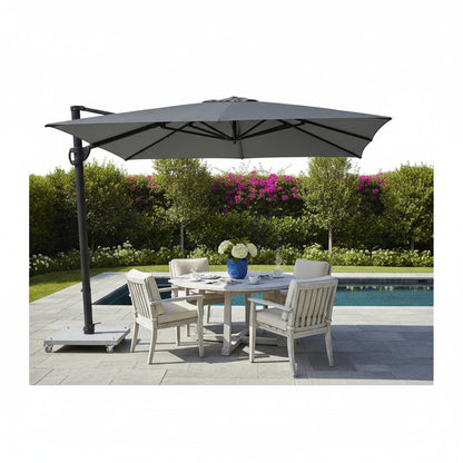 Skyline Design Solstice Shade cantilever parasol with beige fabric and sturdy metal frame, providing shade outdoors.