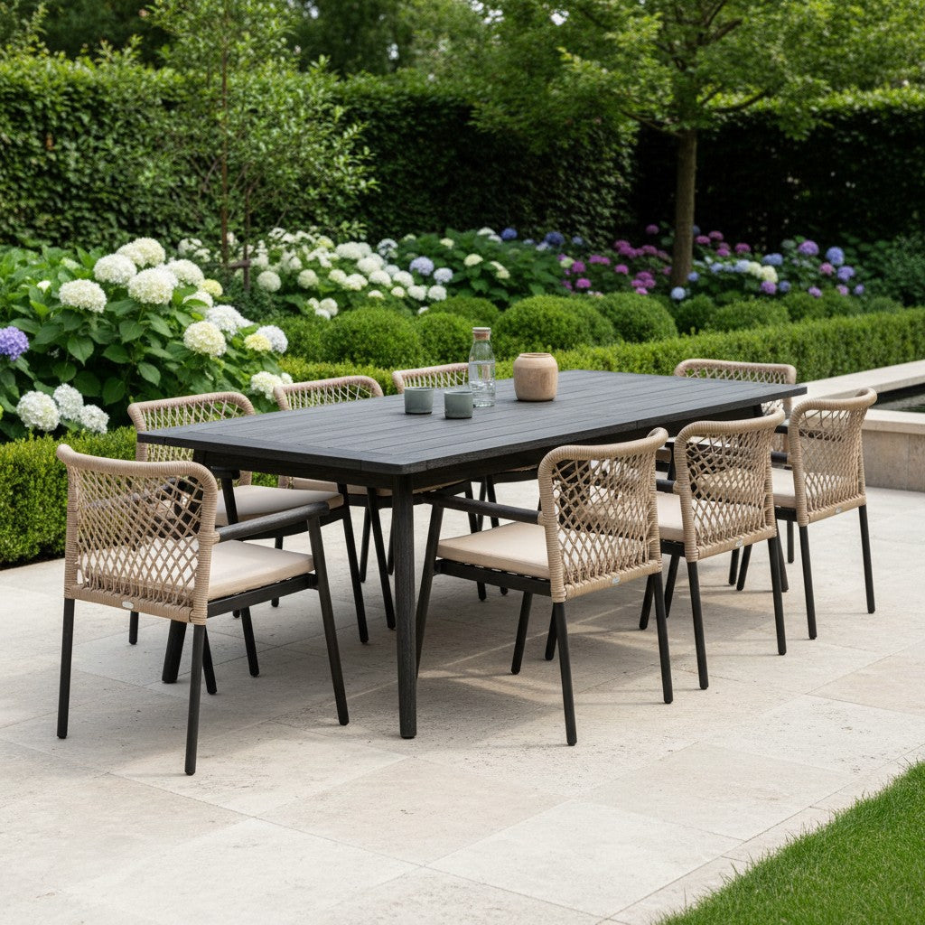 Outdoor dining set featuring black premium teak table and chairs by Jardinico, designed for stylish outdoor meals.