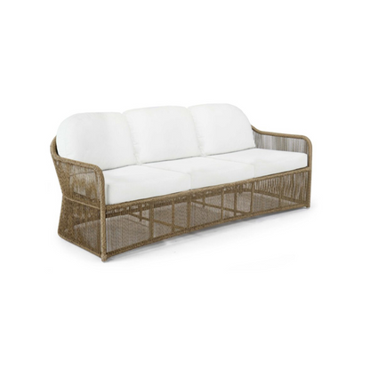 Wicker outdoor sofa with white cushions on a white background