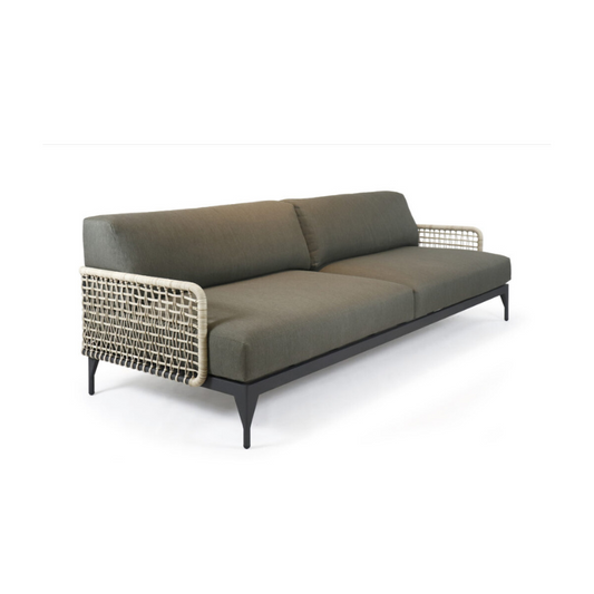 Gray sofa with wicker armrests on a white background