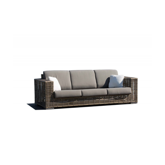 Wicker outdoor sofa with cushions on a white background