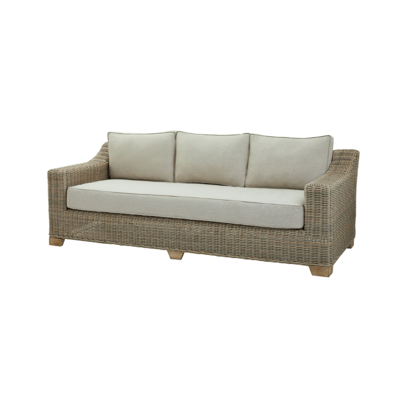 Wicker outdoor sofa with beige cushions on a white background