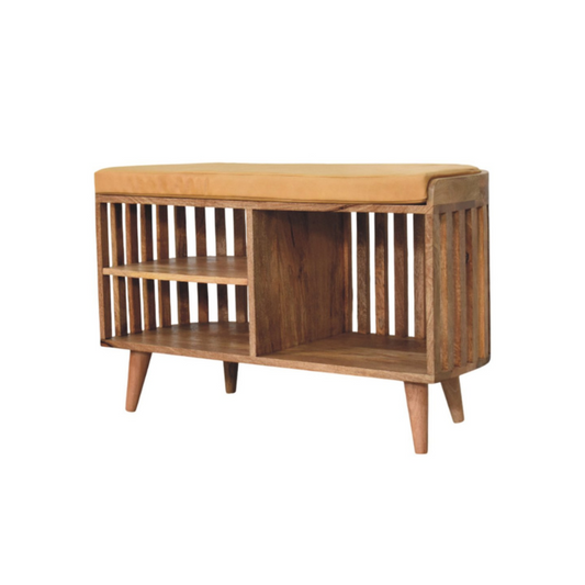 Wooden crib with a cushioned top on a white background