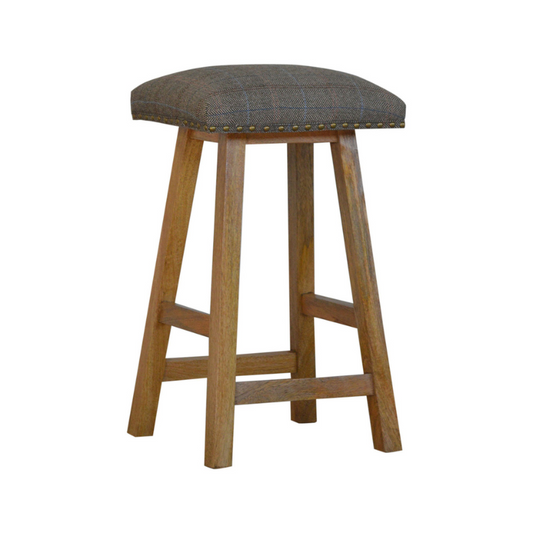Wooden bar stool with a patterned cushion on a white background