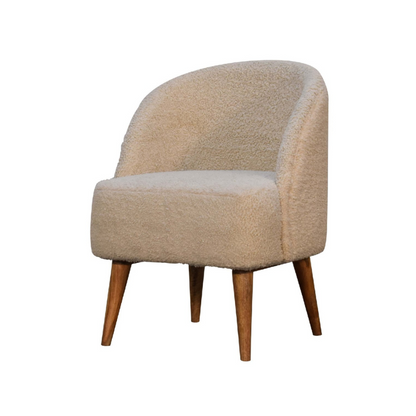 Beige armchair with wooden legs on a white background