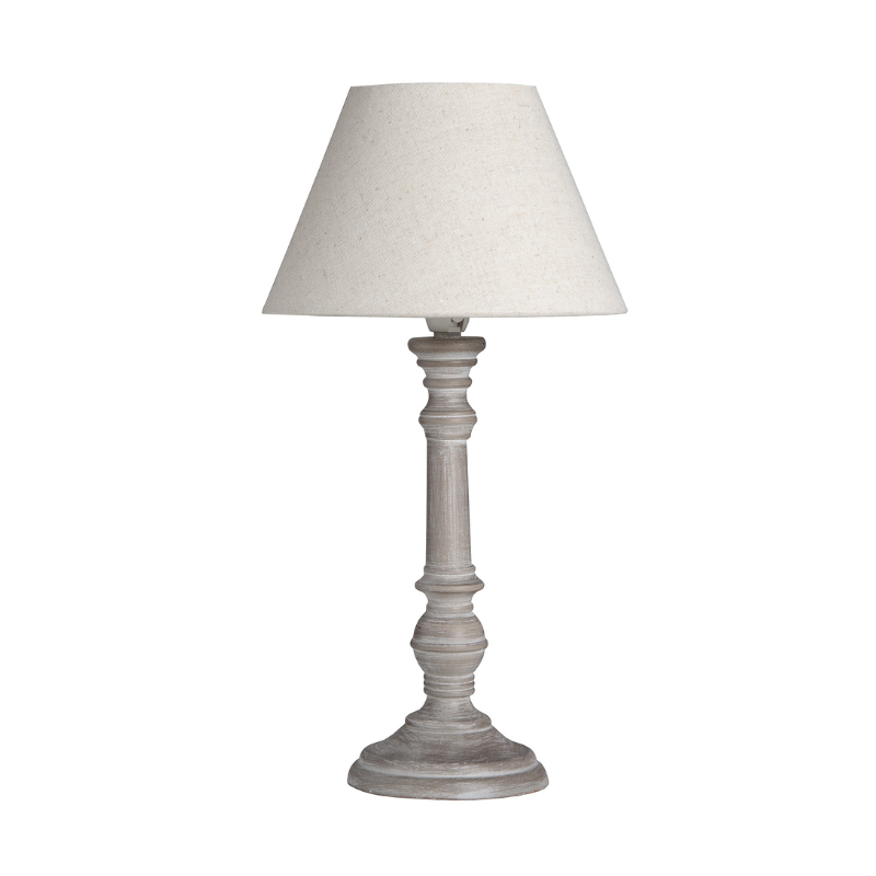 Table lamp with a white shade on a white background