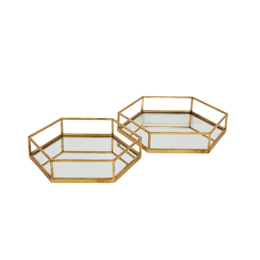 Two gold hexagonal trays with mirror surfaces on a white background