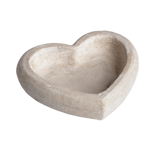 Heart-shaped stone bowl on a white background