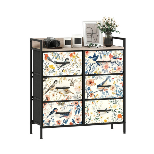 Decorative dresser with floral and bird patterned drawers on a white background