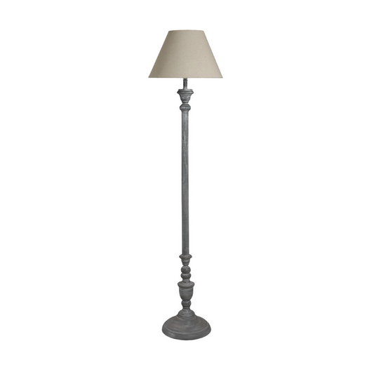 Floor lamp with a beige shade on a white background