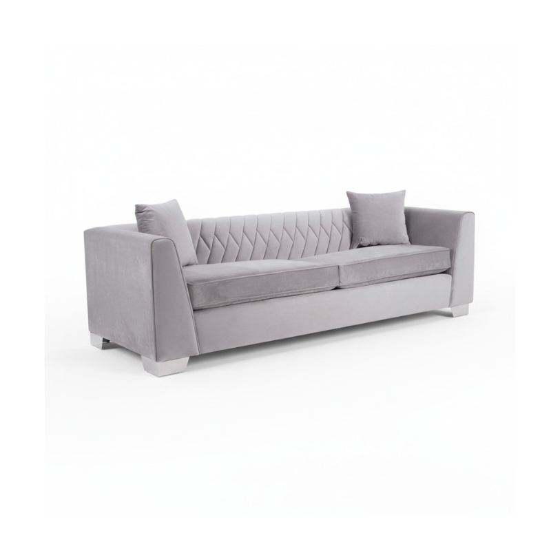 Gray sofa with quilted design on a white background