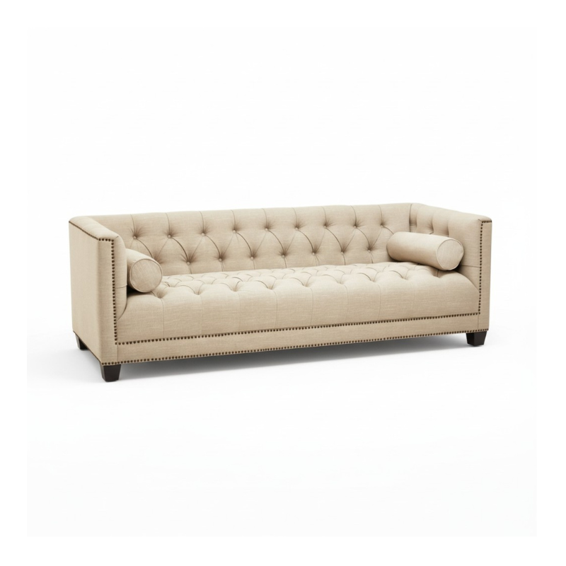 Beige tufted sofa on a white background