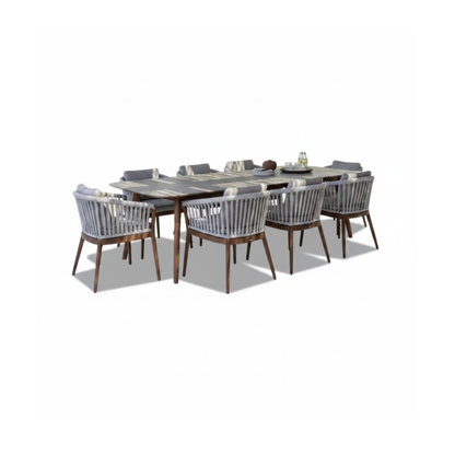 Jardinico Veridian Premium Teak Outdoor Dining Set with a table and six matching chairs in a modern outdoor setting