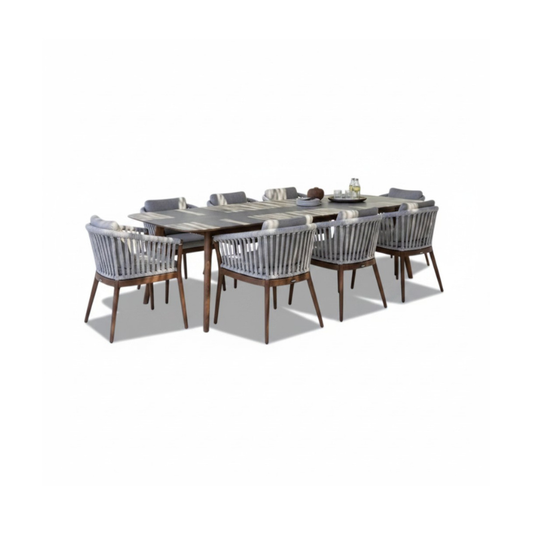 Jardinico Veridian Premium Teak Outdoor Dining Set with a table and six matching chairs in a modern outdoor setting