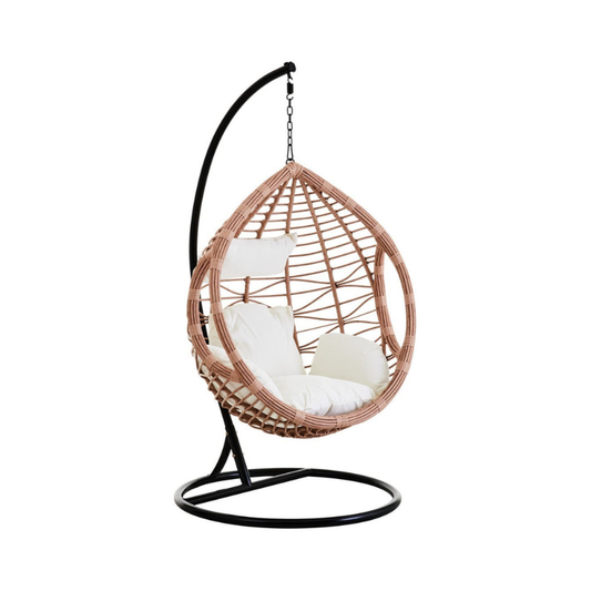 Interior by Premier Terra hanging chair with woven rattan design and plush cushion for indoor or outdoor relaxation.