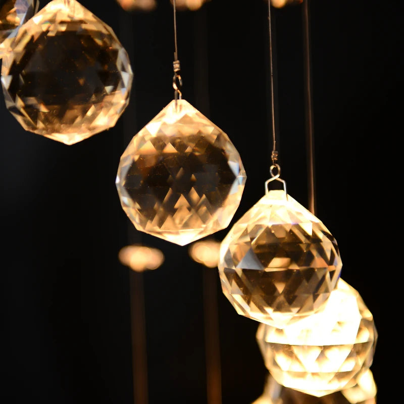 Crystal prisms hanging against a dark background