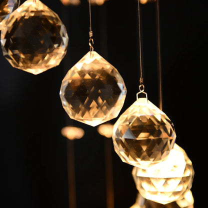 Crystal prisms hanging against a dark background