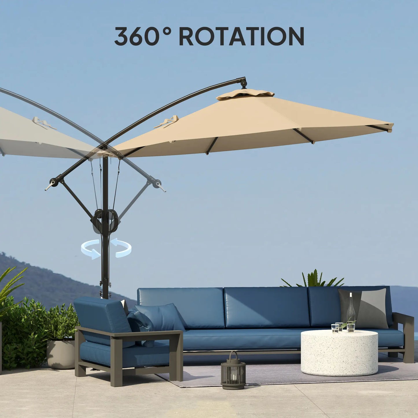 Beige patio umbrella with 360-degree rotation feature on a patio setting with blue sofa and table.