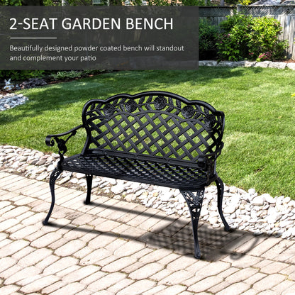 Black 2-seat garden bench on a patio with grass and plants in the background