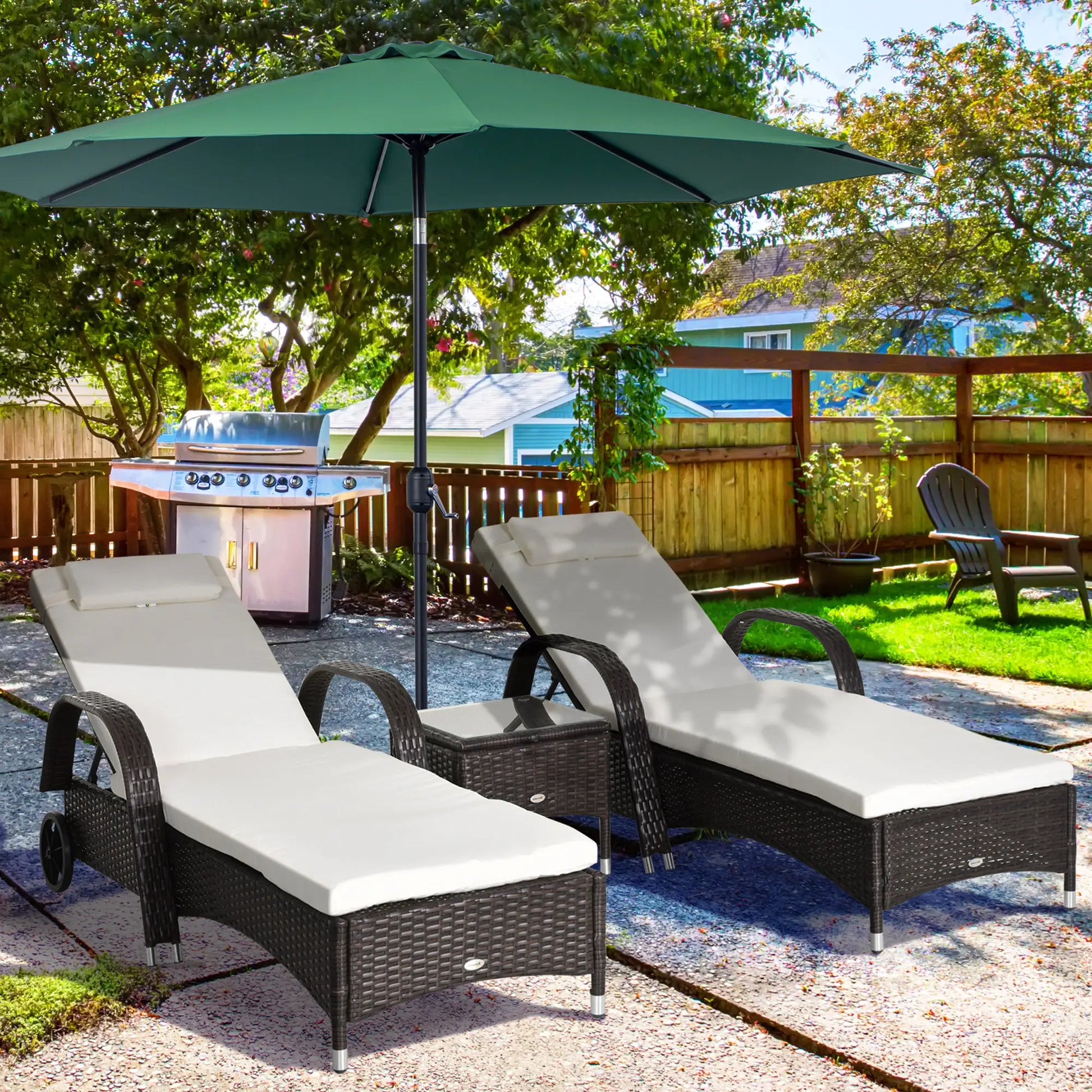 Outdoor patio set with lounge chairs, grill, and umbrella in a backyard setting.