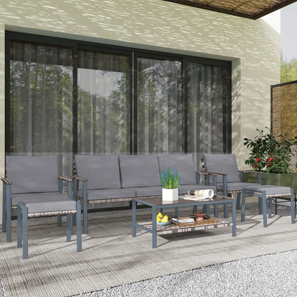 Outdoor patio set with gray cushions on a patio area.