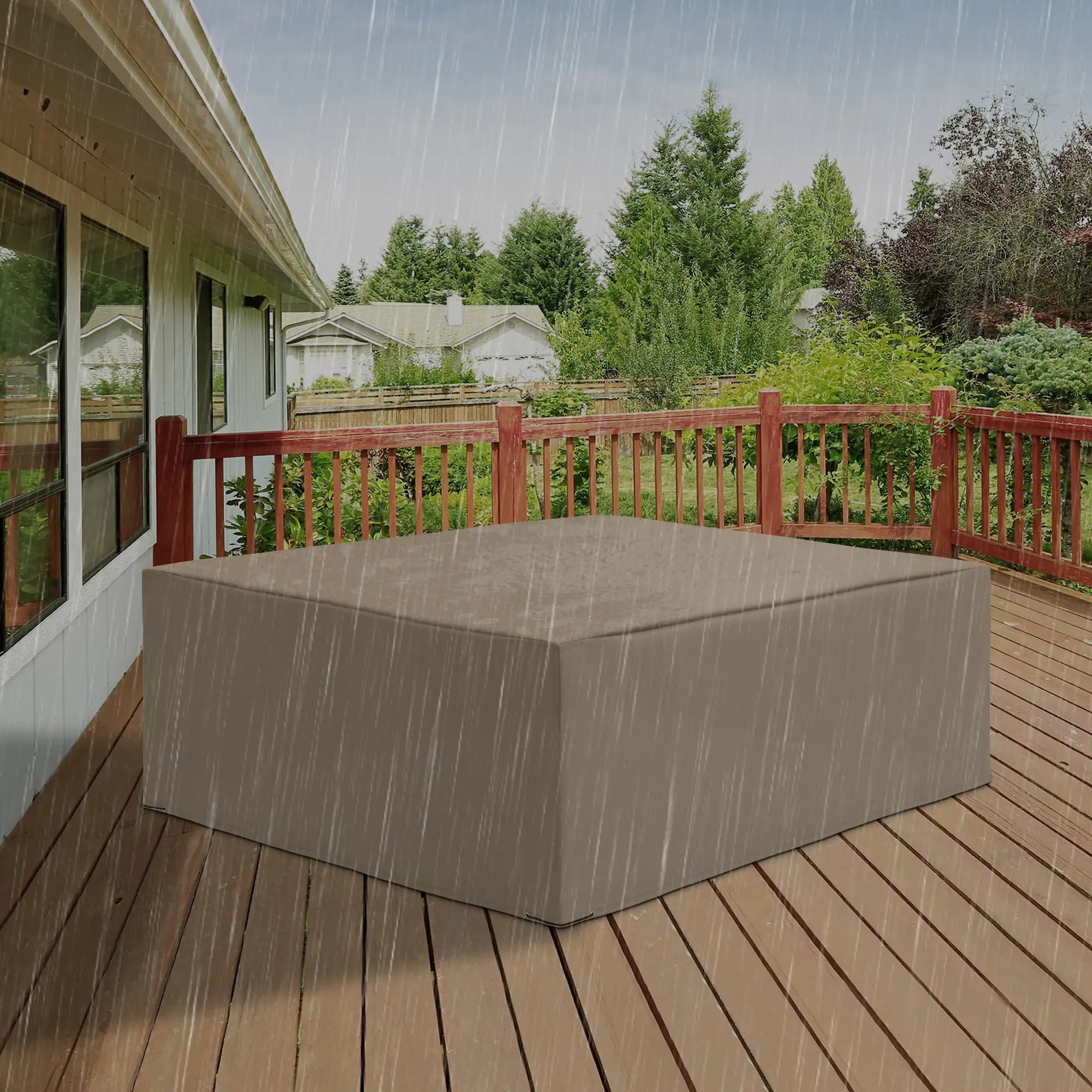Outdoor furniture cover on a wooden deck with rain falling