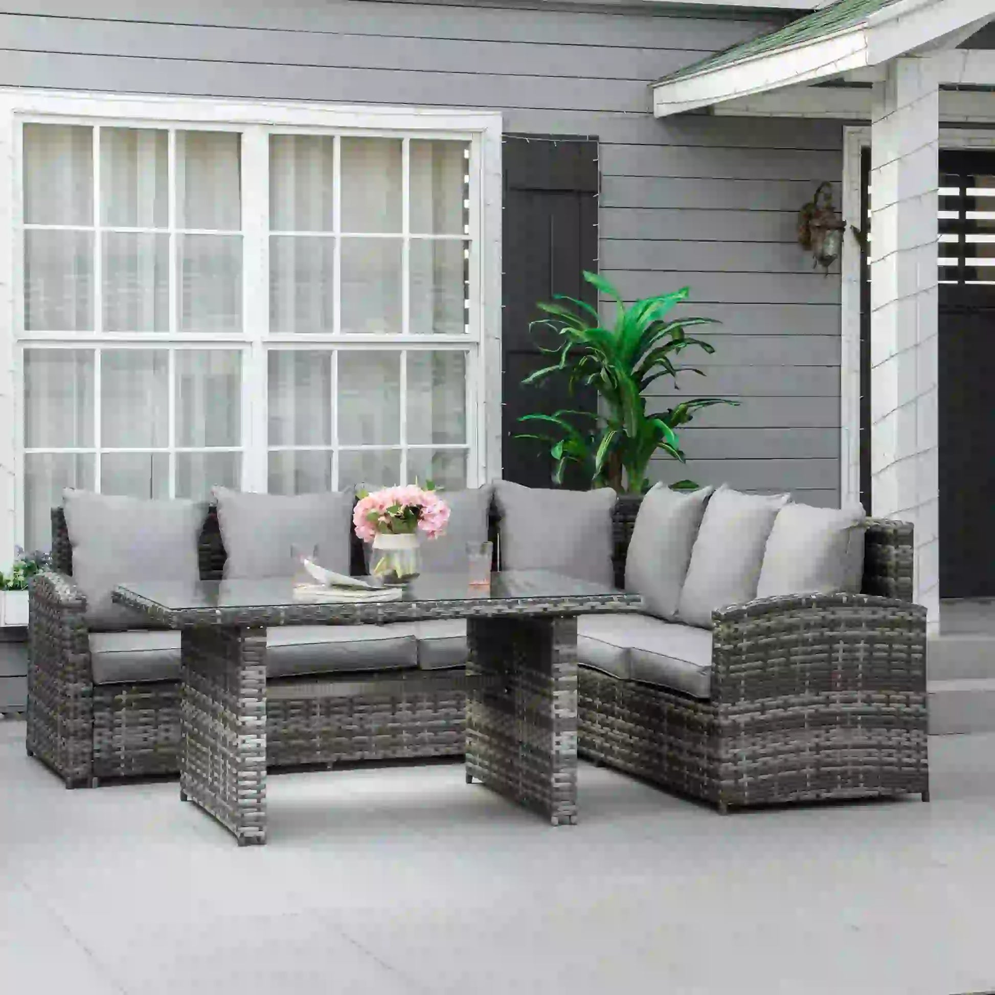 Outdoor patio furniture set with a table and chairs on a patio.