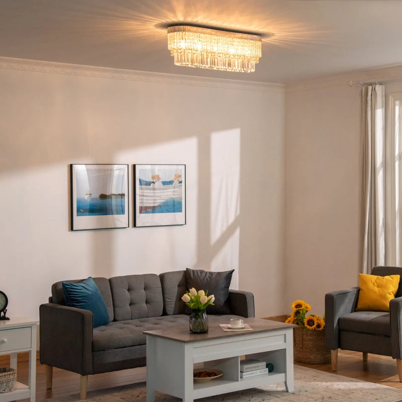 Living room with gray sofa, coffee table, and armchair with decorative pillows.