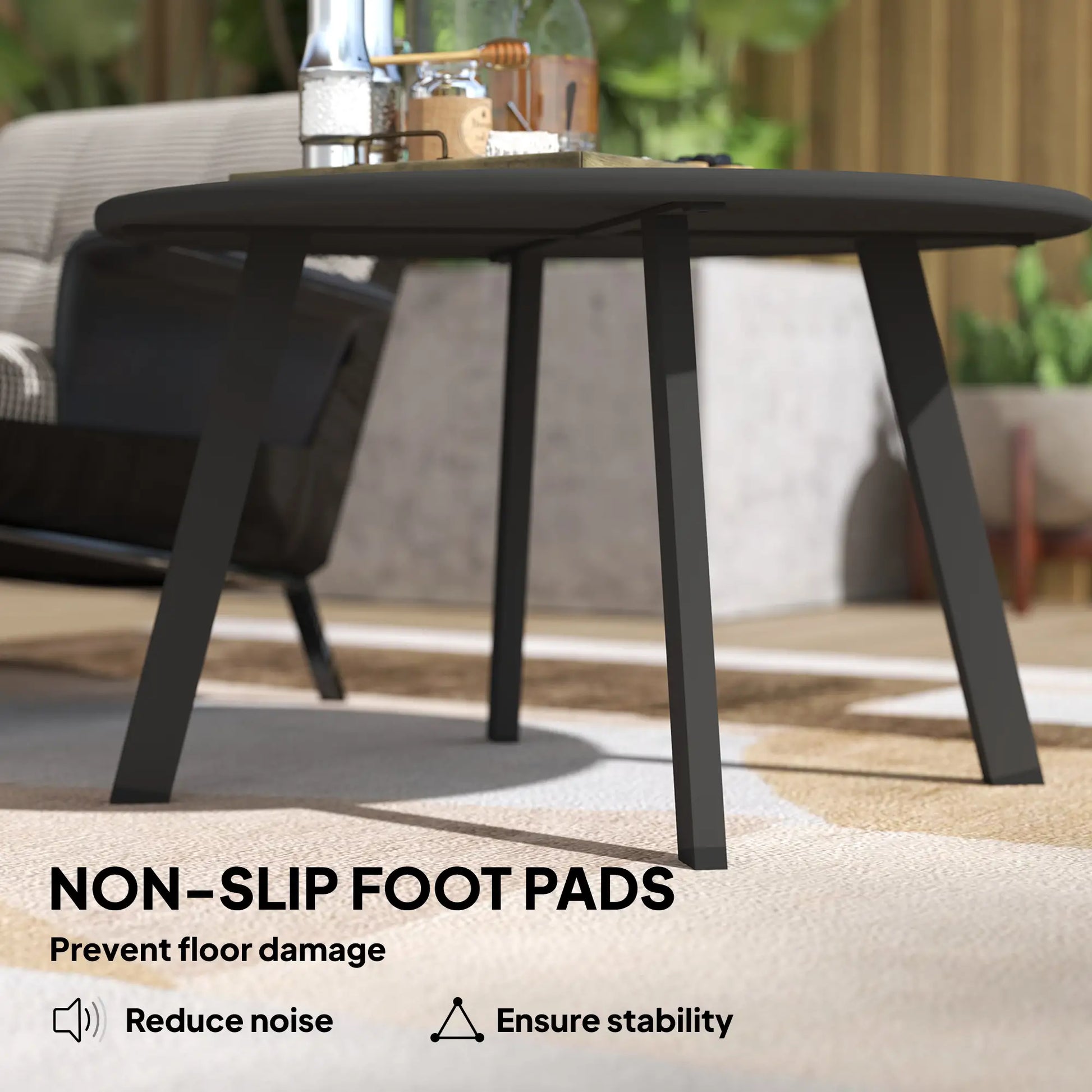 Black outdoor table with non-slip foot pads on a patio setting